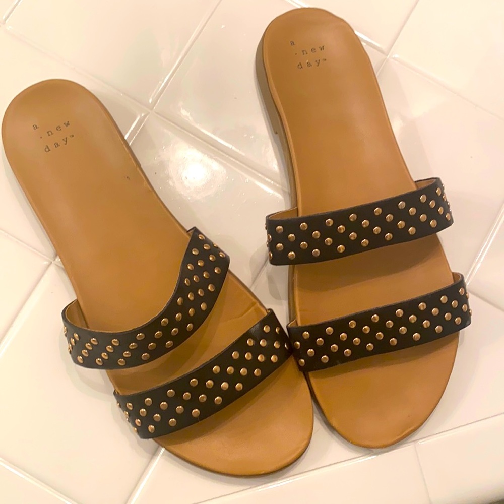 Black sandals with gold studs